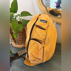Kavu butter yellow sling back rope backpack bag with lots of pockets.